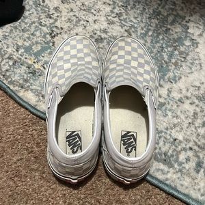 Unisex slip on grey and white checkerboard vans.